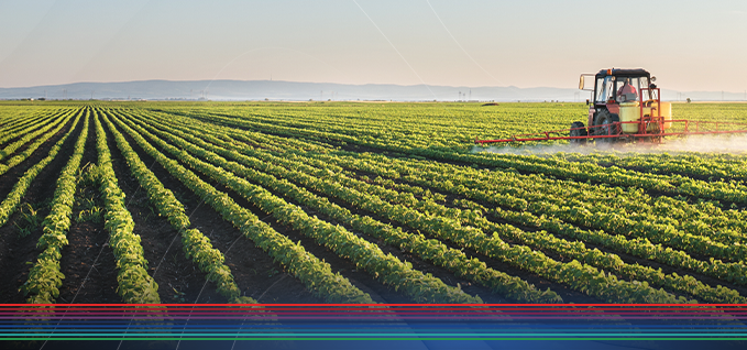 Tractor fertilizing crops