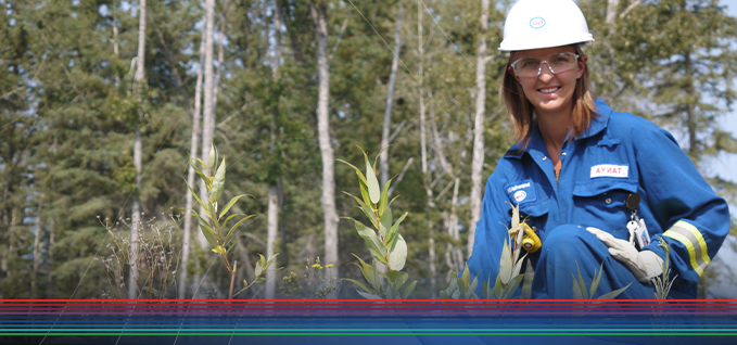 pipeline worker kneeling in field