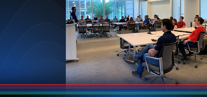 A group of employees sitting in a meeting