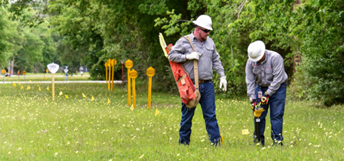 Two workers on a right-of-way