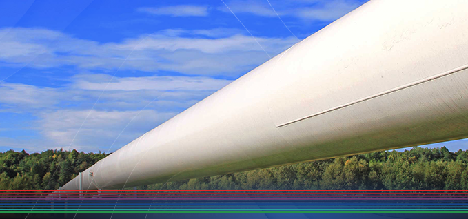 white pipeline with blue sky and trees